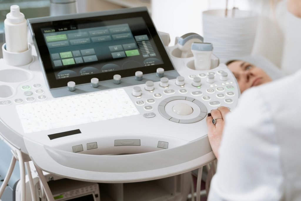 pexels-photo-7088491-7088491 Close-up of a professional conducting an ultrasound examination in a modern medical clinic.